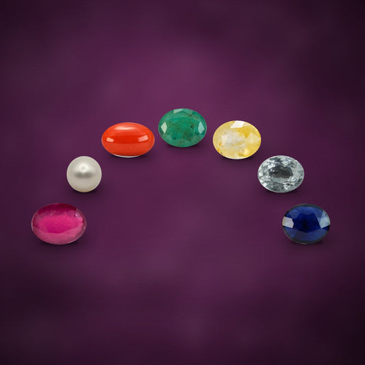 Seven Rashi Ratan gemstones arranged in an arc
